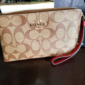Coach Clutch wristlet handbag, brown with red strap, comes in box